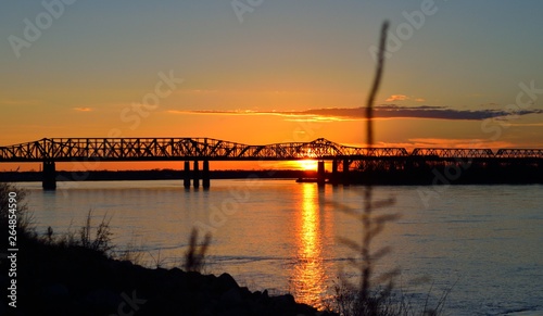 sunset at Memphis-Arkansas bridge over mississippi river