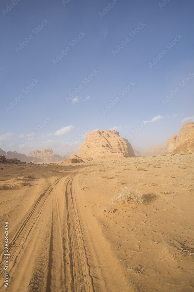 A beautiful day in the Jordanian desert of Wadi Rum. wide dessert with an amazing mountains and sand dunes , amazing scenery that you should see ! A beautiful day in the Jordanian desert of Wadi Rum. wide dessert with an amazing mountains and sand dunes , amazing scenery that you should see !