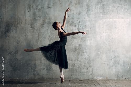 Ballerina female. Young beautiful woman ballet dancer, arabesque.