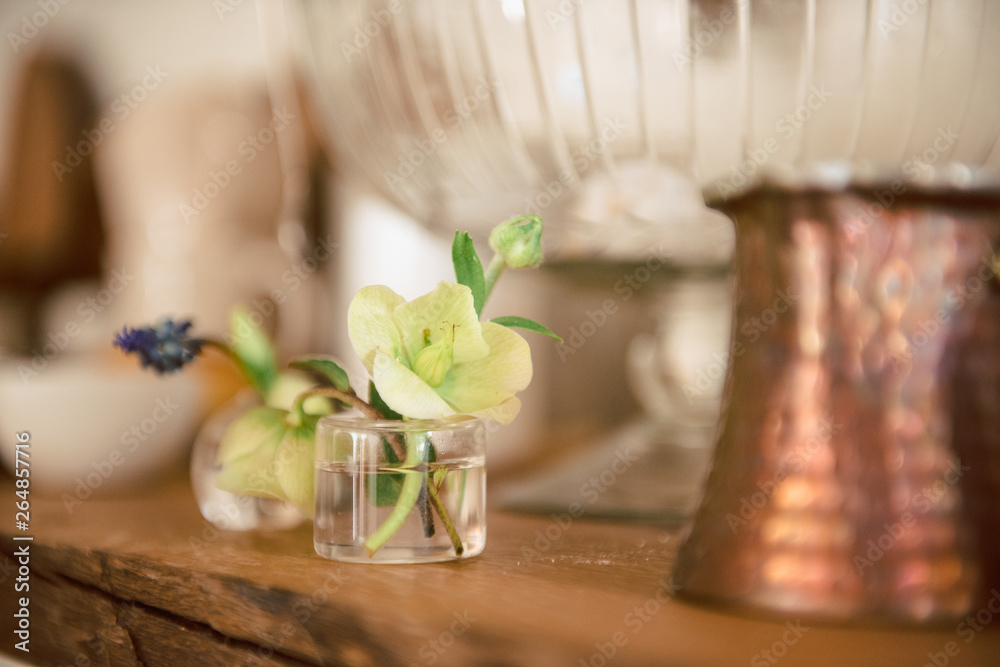 Beautiful flower in a vase. Fashionable decorations and table setting for the holiday and wadba. Fresh flowers trend of this year on registration