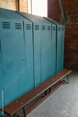 Large green lockers in the sports locker room