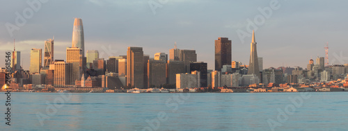 The northern California city of San Francisco skyline is seen at dawn. This beautiful city is surrounded by San Francisco Bay and the Pacific Ocean.