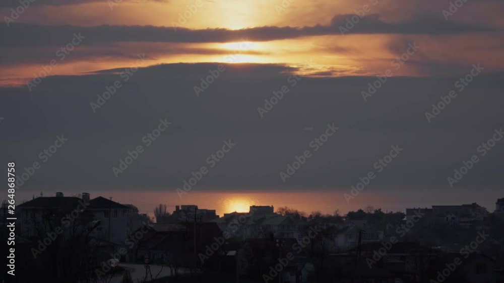 Nice sunrise among the clouds over the ocean or sea Nice sunrise among the clouds over the ocean or sea
