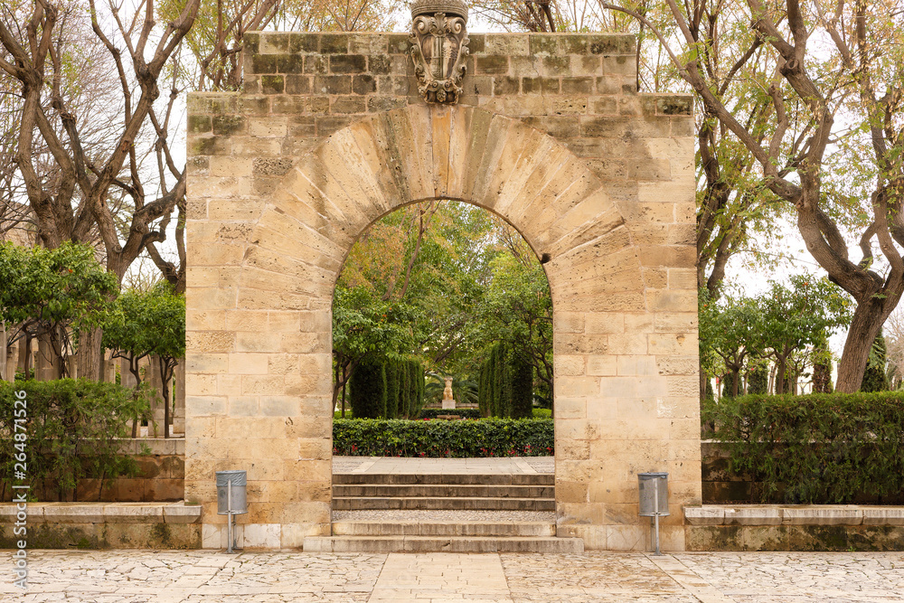 Palma de Mallorca, Spain - March 19, 2019 : public garden and art park in the center of Palma old town next to the kings palace