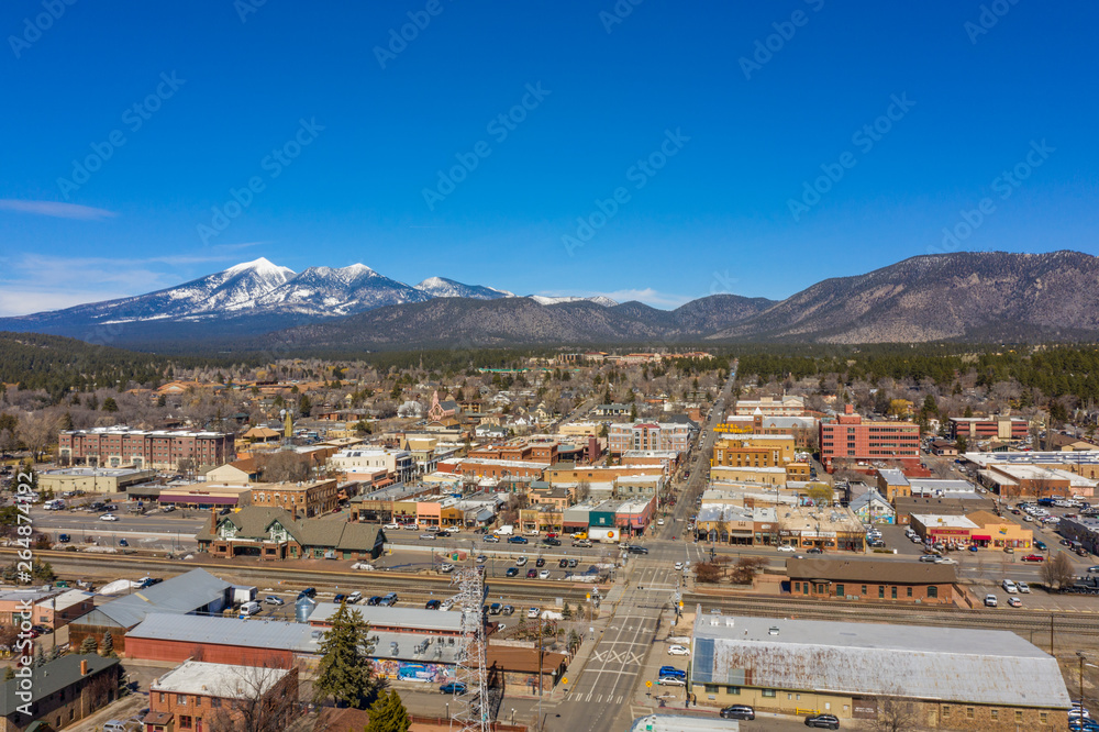 Aerial photo of a small town with mountains in the background