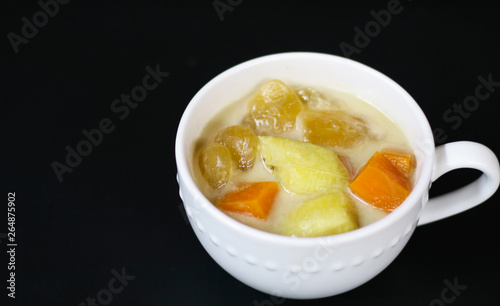 Indonesian sweet desserts or kolak on black background. 