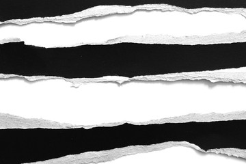 old torn black paper isolated on white background