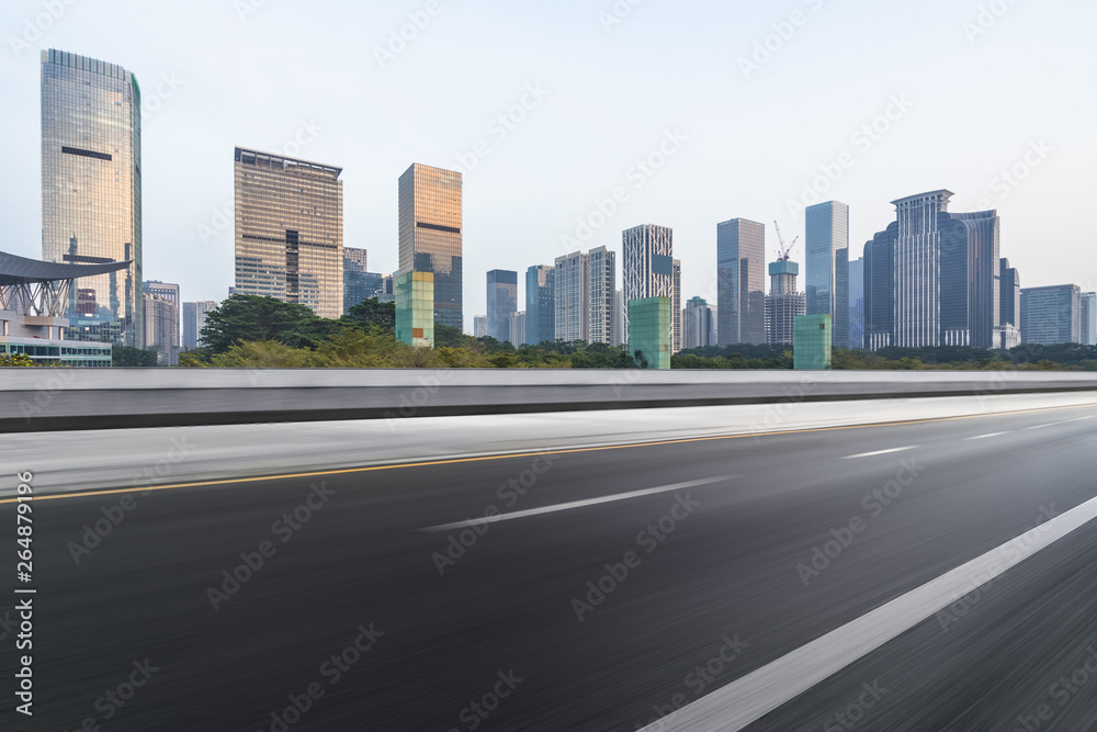 empty asphalt road with city skyline background in china. empty asphalt road with city skyline background in china.