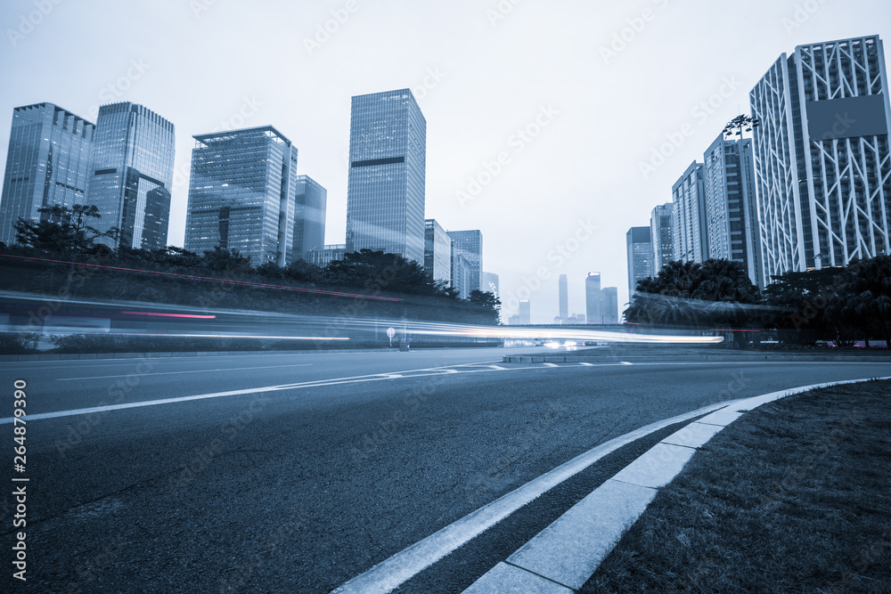 urban city road with motion bus at twilight, china.