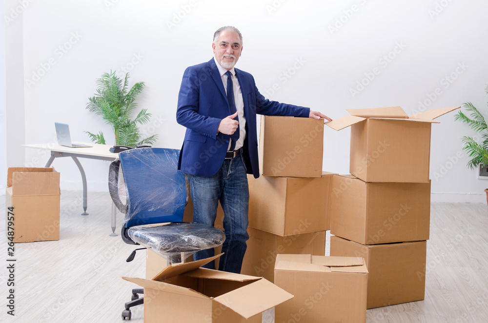 Aged businessman moving to new workplace Aged businessman moving to new workplace