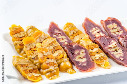 Tasty oriental sweets churchkhela , isolated on white, Georgia. photo