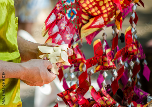 Make Thai style palm leaf carp fish mobile handicraft activities in Songkran festival.