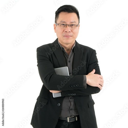 Handsome smiling business man in suit holding mobile device, isolated on white background