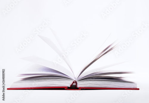 Closeup view of open book with pages in red hard cover, isolated on white background © Forgem