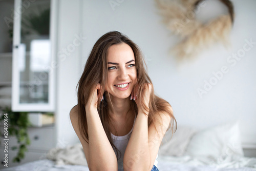 Portrait of a beautiful smiling woman in the morning at home.