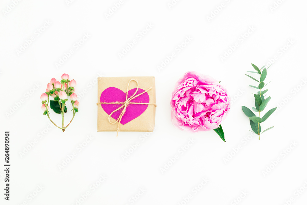 Naklejka premium Love composition. Concept with pink peony flower, hypericum and eucalyptus with gift box on white background. Flat lay, top view