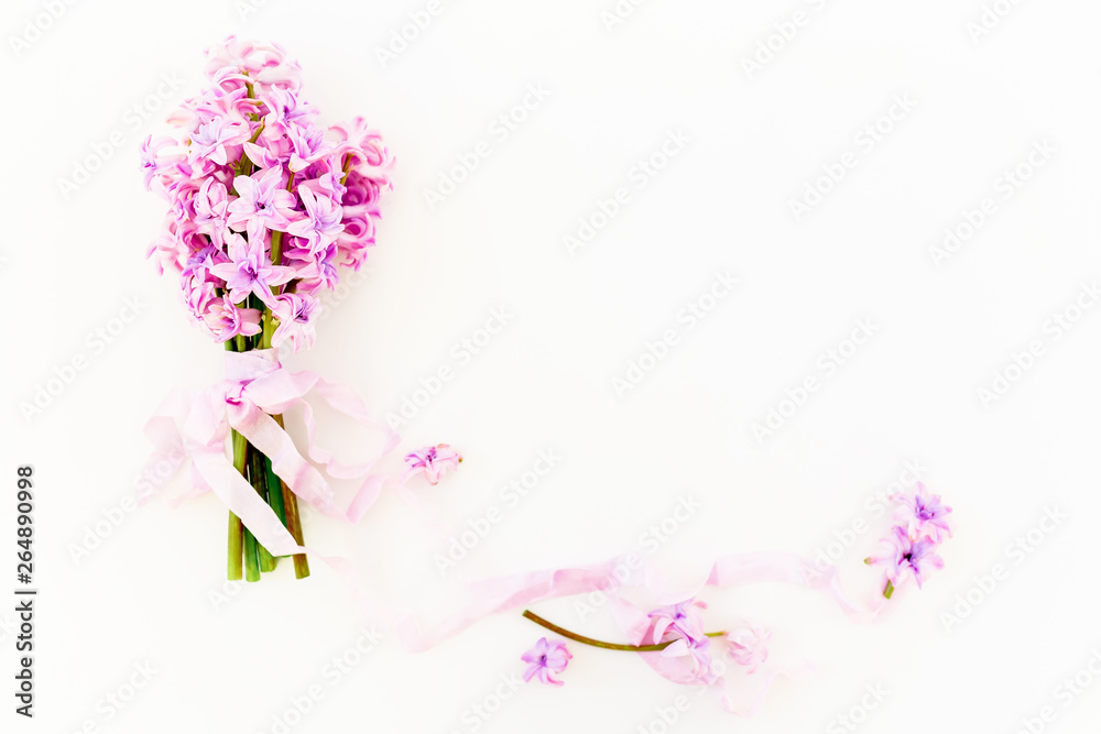 Floral bouquet of hyacinth flowers, petals and tapes on white background. Flat lay, top view. Floral bouquet of hyacinth flowers, petals and tapes on white background. Flat lay, top view.