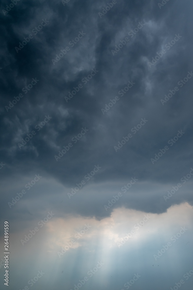 Obraz premium Light in the Dark and Dramatic Storm Clouds background
