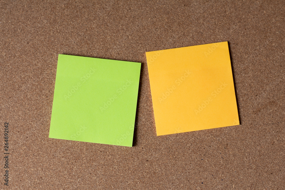 sticky notes on cork board
