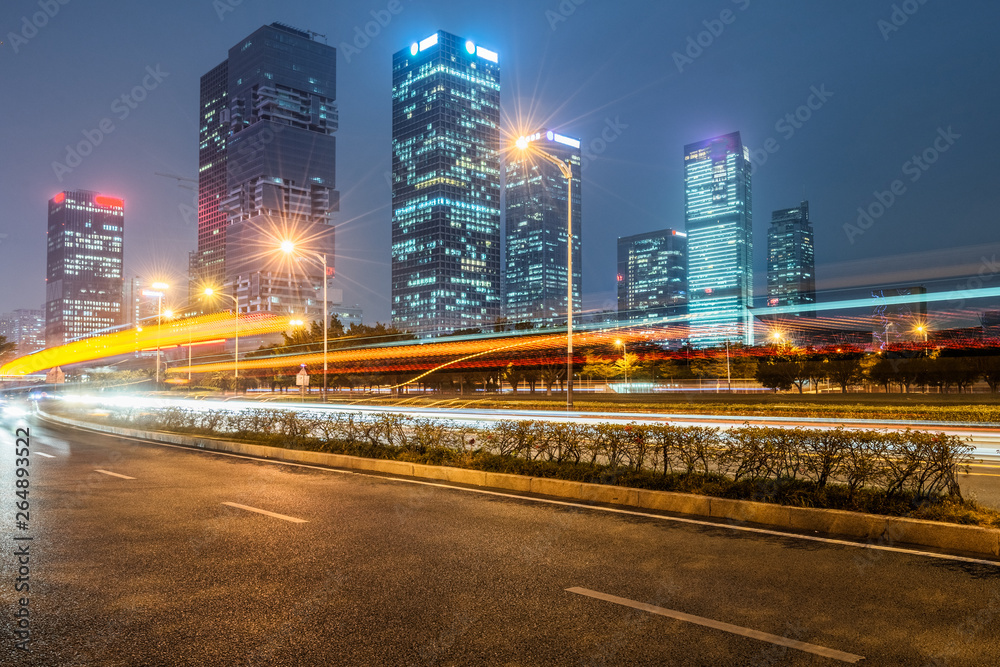 Fototapeta premium the light trails on the modern building background.