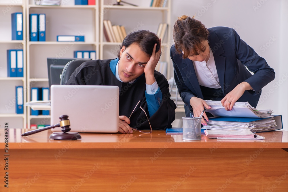 Two lawyers working in the office Two lawyers working in the office