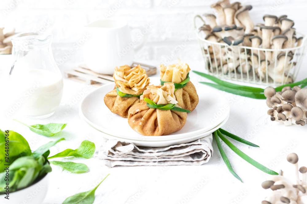 Pancake bags stuffed with with fried oyster mushrooms with spinach Pancake bags stuffed with with fried oyster mushrooms with spinach