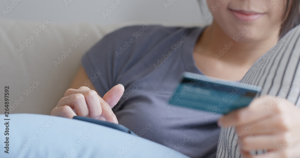 Woman use mobile phone for shopping online with credit card Woman use mobile phone for shopping online with credit card