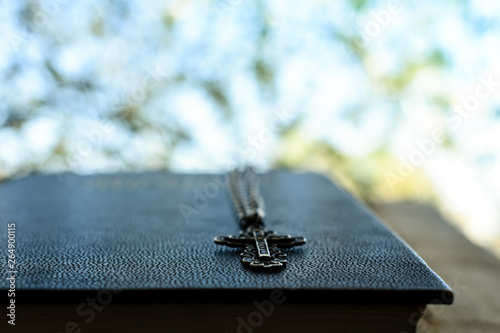 biblical book bible cross silver chain grace blessing faith belief religion creed prayer goodness