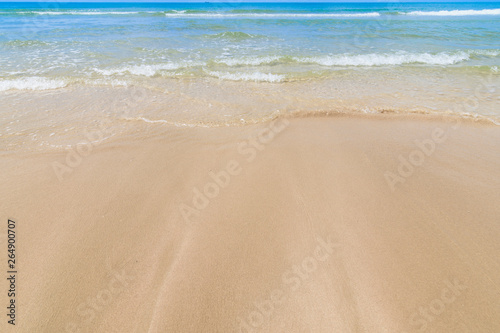 Landscape of the sand beach with cloud sky ,a wild tropical beach in southern part of Thailand in sunny day.