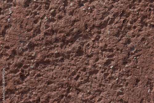 close up of red stony wall