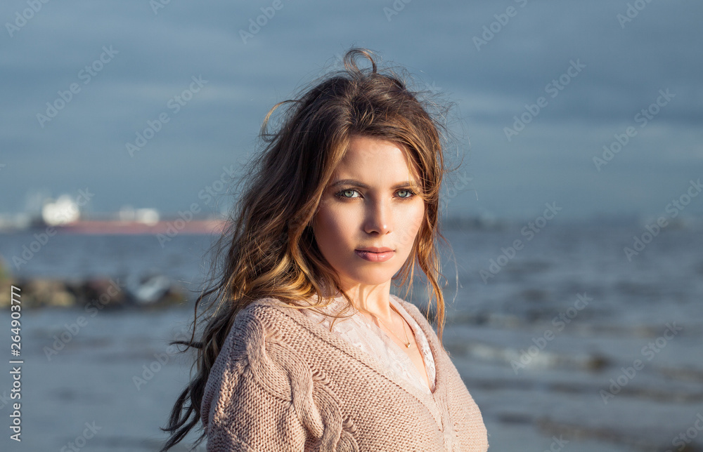 Young woman on blue natural background, romantic portrait Young woman on blue natural background, romantic portrait