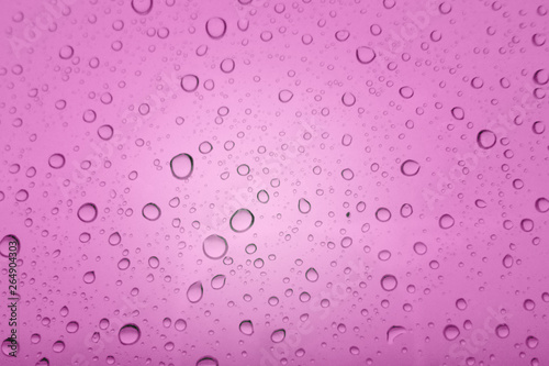 Water droplets texture on purple background