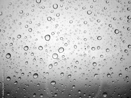Close-up of water drops on glass surface as background