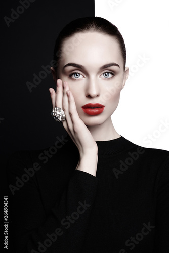 beautiful young woman with big ring pose in studio