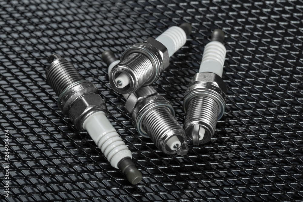 Spark plugs on black background Spark plugs on black background