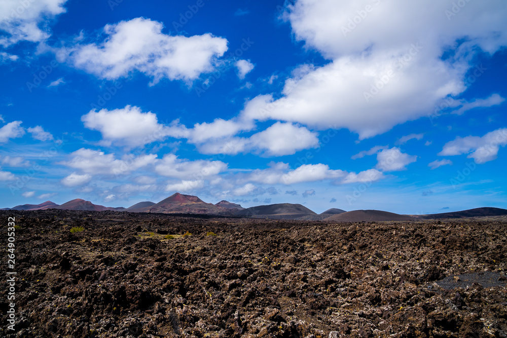 Spain, Lanzarote, Endless solidified lava fields of caldera surrounding colorful volcanoes