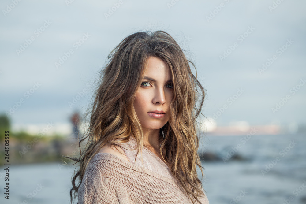 Perfect woman on ocean background, romantic portrait