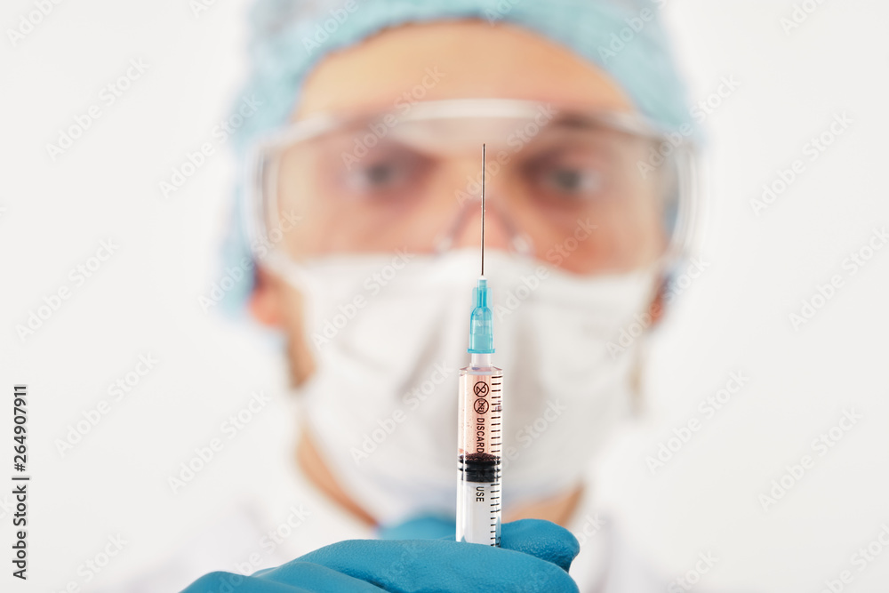 Medical assistant with syringe Medical assistant with syringe