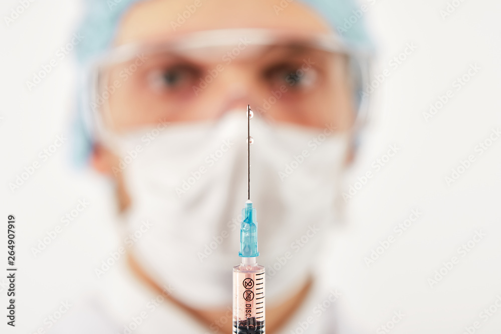 Drops on syringe needle edge Drops on syringe needle edge