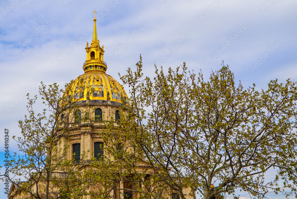 View on the Dome church of Les Invalides through trees in spring in Paris France. April 2019
