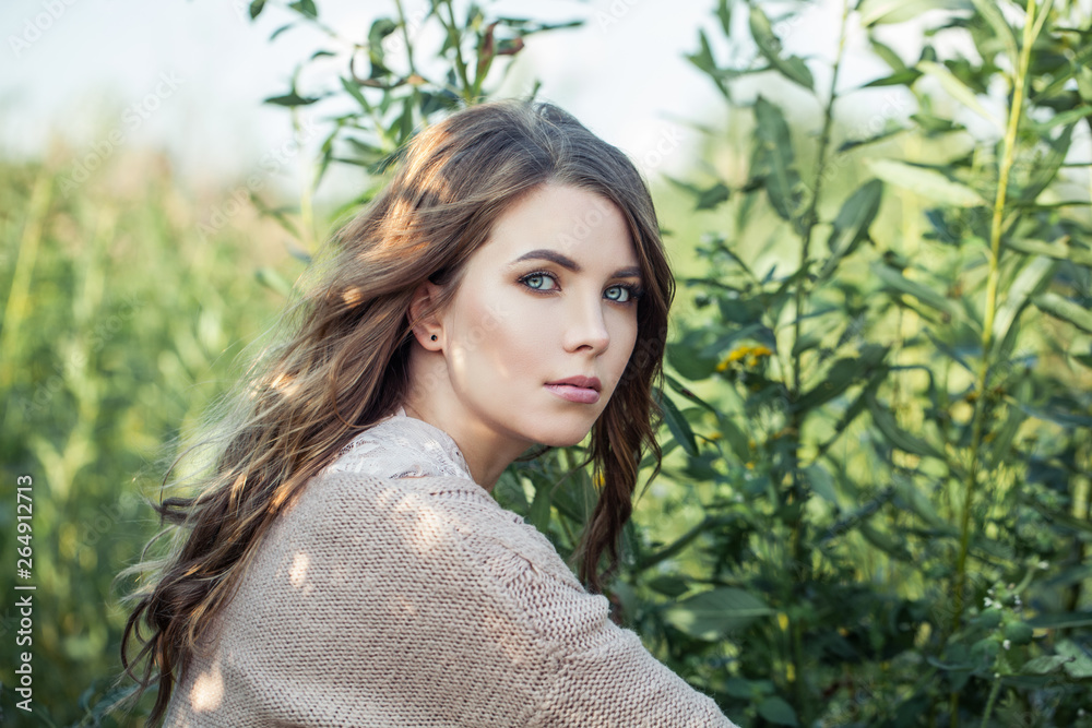 Beautiful face. Cute young woman relaxing on greenery foliage background Beautiful face. Cute young woman relaxing on greenery foliage background