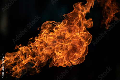 Closeup Fire flames from gas explosion on black background.