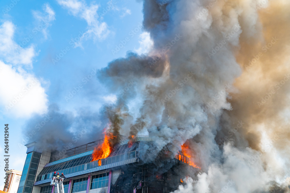 Burning building in thick smoke