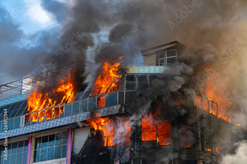 Burning building in thick smoke