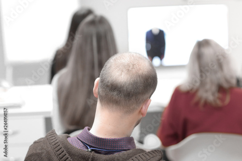 rear view.blurred image of people in the conference room