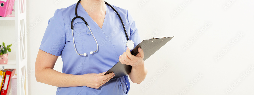 Portrait of cheerful female doctor in hospital with crossed hands copy space. Portrait of cheerful female doctor in hospital with crossed hands copy space.