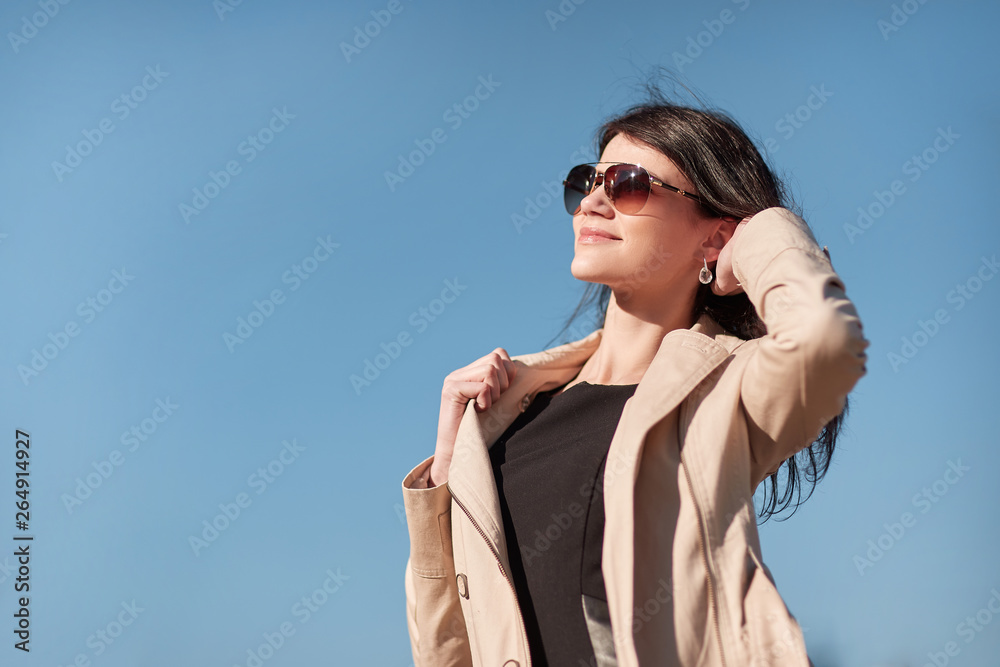 portrait of a young successful woman against the sky portrait of a young successful woman against the sky
