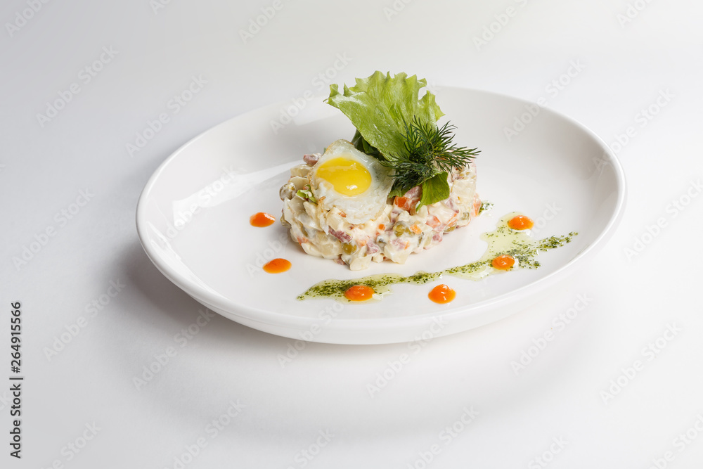 Food on white plate. Side dish. Salad. Greenery. Egg. Food on white plate. Side dish. Salad. Greenery. Egg.