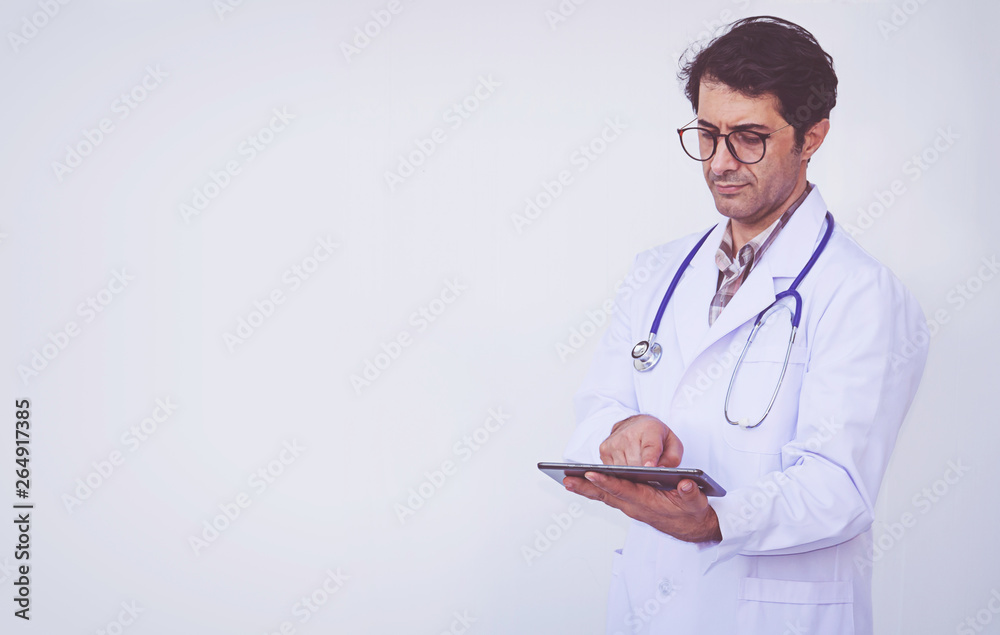 doctor checking patient information on a tablet device doctor checking patient information on a tablet device