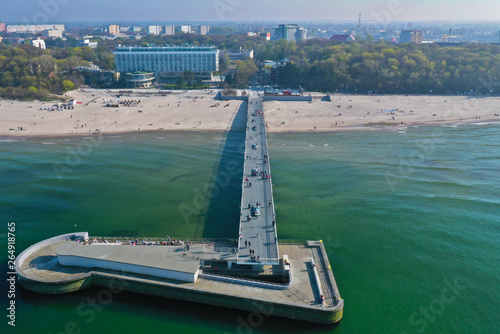 Photos Aerial view on Kolobrzeg city, area of pier and beach at baltic sea shore